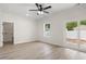 Bedroom with sliding glass doors, window and view of laundry room at 2428 Park St., North Myrtle Beach, SC 29582