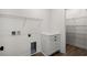 Functional laundry room features shelving and cabinets for storage at 2428 Park St., North Myrtle Beach, SC 29582