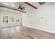 Bright living room with wooden ceiling beams, hardwood floors and ample natural light at 2428 Park St., North Myrtle Beach, SC 29582
