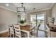 Bright dining area featuring stylish lighting and a view of the outdoor deck at 301 43Rd Ave. N, North Myrtle Beach, SC 29582