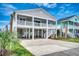 Charming stilt home with spacious porch, perfect for relaxing and enjoying the coastal breeze at 301 43Rd Ave. N, North Myrtle Beach, SC 29582