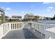 Dock overlooking canal waterfront with neighborhood homes in the distance at 306 59Th Ave. N, North Myrtle Beach, SC 29582