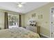 Second bedroom with king-size bed and sliding glass doors at 307 Cumberland Terrace Dr. # 5-E, Myrtle Beach, SC 29572