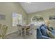 Bright dining area with a table and chairs near a window at 307 Cumberland Terrace Dr. # 5-E, Myrtle Beach, SC 29572