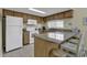 Well-equipped kitchen featuring granite countertops and modern appliances at 307 Cumberland Terrace Dr. # 5-E, Myrtle Beach, SC 29572