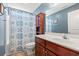 Bathroom with blue walls and a patterned shower curtain at 352 Beulah Circle, Conway, SC 29527