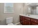 Clean bathroom with wooden vanity and tiled floor at 352 Beulah Circle, Conway, SC 29527