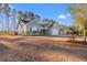 Two-story house with attached garage, American flag, and mature landscaping at 352 Beulah Circle, Conway, SC 29527