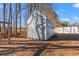 Gray storage shed in backyard with wooden door and window at 352 Beulah Circle, Conway, SC 29527