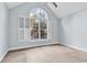 Bright bedroom featuring an arched window and ceiling fan at 385 Muirfield Dr., Pawleys Island, SC 29585