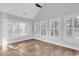 Bright bedroom with plantation shutters and wood floors at 385 Muirfield Dr., Pawleys Island, SC 29585