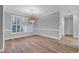 Bright dining room with hardwood floors and plantation shutters at 385 Muirfield Dr., Pawleys Island, SC 29585