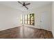 Sun-filled bedroom with hardwood floors and a large window offering abundant natural light at 401 Indian Wells Ct. # 401, Murrells Inlet, SC 29576