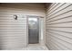 Exterior view of the front door with glass and side panel allowing natural light at 401 Indian Wells Ct. # 401, Murrells Inlet, SC 29576