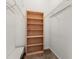 Walk-in closet features multiple shelves and built-in bookcase at 401 Indian Wells Ct. # 401, Murrells Inlet, SC 29576