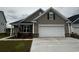 Charming home with a two-car garage and neatly landscaped front yard at 4040 Bucolic Loop, Myrtle Beach, SC 29588