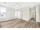 Bedroom with light-colored walls, wood-look flooring, and bright natural light at 413 West Palms Dr., Myrtle Beach, SC 29579