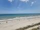 Beach with people and blue umbrellas from above at 4679 Wild Iris Dr. # 101, Myrtle Beach, SC 29577