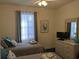 Bright bedroom with twin beds, dresser, and TV at 4679 Wild Iris Dr. # 101, Myrtle Beach, SC 29577