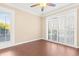 Bright bedroom with wood-look floors and sliding glass doors leading to a balcony at 4714 Cobblestone Dr. # L2, Myrtle Beach, SC 29577