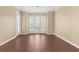 Spacious bedroom with large windows and wood-look floors at 4714 Cobblestone Dr. # L2, Myrtle Beach, SC 29577