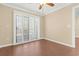 Bright bedroom with wood-look tile floors and access to balcony at 4714 Cobblestone Dr. # L2, Myrtle Beach, SC 29577