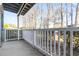 Private patio with white railing and wooded views at 4714 Cobblestone Dr. # L2, Myrtle Beach, SC 29577