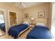 Bedroom with twin beds, shared bath access, and window with blinds at 4809 Luster Leaf Circle # 102, Myrtle Beach, SC 29577