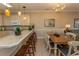 Kitchen and dining area with wood table and chairs at 4809 Luster Leaf Circle # 102, Myrtle Beach, SC 29577