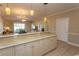 Open kitchen with breakfast bar and view to living room at 4809 Luster Leaf Circle # 102, Myrtle Beach, SC 29577