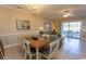 Living room with tiled floor, sofa, and patio access at 4809 Luster Leaf Circle # 102, Myrtle Beach, SC 29577