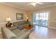 Living room with comfortable sofas and access to patio at 4809 Luster Leaf Circle # 102, Myrtle Beach, SC 29577