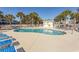 Community pool with lounge chairs and a snack bar at 4809 Luster Leaf Circle # 102, Myrtle Beach, SC 29577