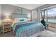 Bedroom with queen bed, access to patio, and tennis court view at 5905 South Kings Hwy. # 5105-D, Myrtle Beach, SC 29575