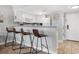 Kitchen with breakfast bar and three leather stools at 5905 South Kings Hwy. # 5105-D, Myrtle Beach, SC 29575