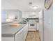Well-equipped kitchen featuring white cabinets and appliances at 5905 South Kings Hwy. # 5105-D, Myrtle Beach, SC 29575