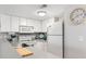 Modern kitchen with white cabinets and gray countertops at 5905 South Kings Hwy. # 5105-D, Myrtle Beach, SC 29575