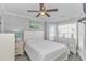 Bright bedroom with a queen bed, window seat, and ceiling fan at 6001-1028 S Kings Hwy., Myrtle Beach, SC 29575