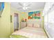 Light and airy bedroom with a queen-size bed and coastal artwork at 6001-Z34 S Kings Hwy., Myrtle Beach, SC 29575