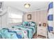 Cozy bedroom featuring a nautical-themed bedspread and white dresser at 6001-Z34 S Kings Hwy., Myrtle Beach, SC 29575