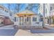 Cute beach cottage with a yellow awning and white picket fence at 6001-Z34 S Kings Hwy., Myrtle Beach, SC 29575