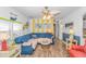 Bright living room with blue sectional sofa and beach decor at 6001-Z34 S Kings Hwy., Myrtle Beach, SC 29575
