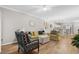 Living room featuring hardwood floors and comfy yellow couch at 601 N Hillside Dr. # 4223, North Myrtle Beach, SC 29582