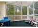 Relaxing screened porch with rocking chairs and blue table at 601 N Hillside Dr. # 4223, North Myrtle Beach, SC 29582