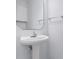 Small bathroom with pedestal sink and mirror at 618 3Rd Ave. S # 4B, North Myrtle Beach, SC 29582