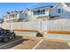 Townhouse exterior with parking and white fence at 618 3Rd Ave. S # 4B, North Myrtle Beach, SC 29582