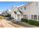 Row of townhouses with neatly landscaped yards and walkways at 618 3Rd Ave. S # 4B, North Myrtle Beach, SC 29582