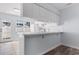 White kitchen with ample cabinetry, tile flooring, and appliances at 618 3Rd Ave. S # 4B, North Myrtle Beach, SC 29582