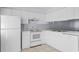 Efficient kitchen with white cabinets and appliances at 618 3Rd Ave. S # 4B, North Myrtle Beach, SC 29582