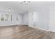 Spacious living room with light walls and wood-look flooring at 618 3Rd Ave. S # 4B, North Myrtle Beach, SC 29582